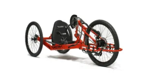 Sport-On XCR: Handcycle 5 Adaptive red three-wheeled off-road handcycle for disabled people, enabling access to nature with our not-for-profit outdoor activities.